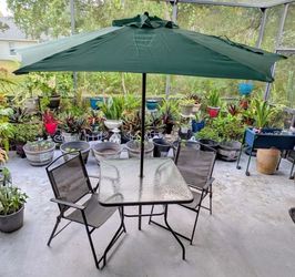Metal and Glass Patio Table Set with Umbrella