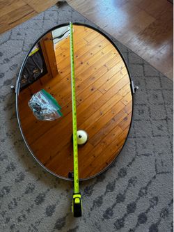 Silver Oval Bathroom Mirror pivots