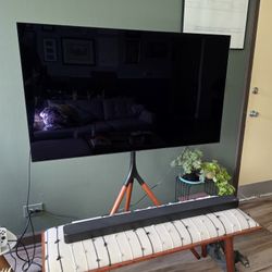 LG Oled TV, Sound Bar, And Stand