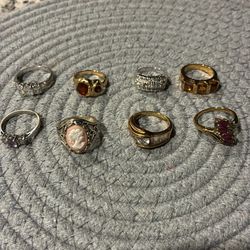 A lot of 8 costume jewelry rings not real gold nor silver