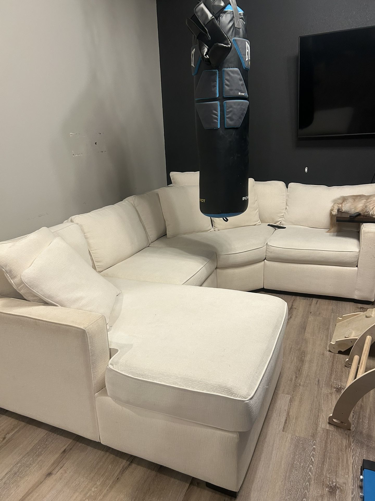 White Sectional With Rolling Storage Ottoman