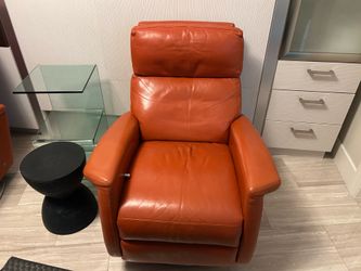 Two orange recliners