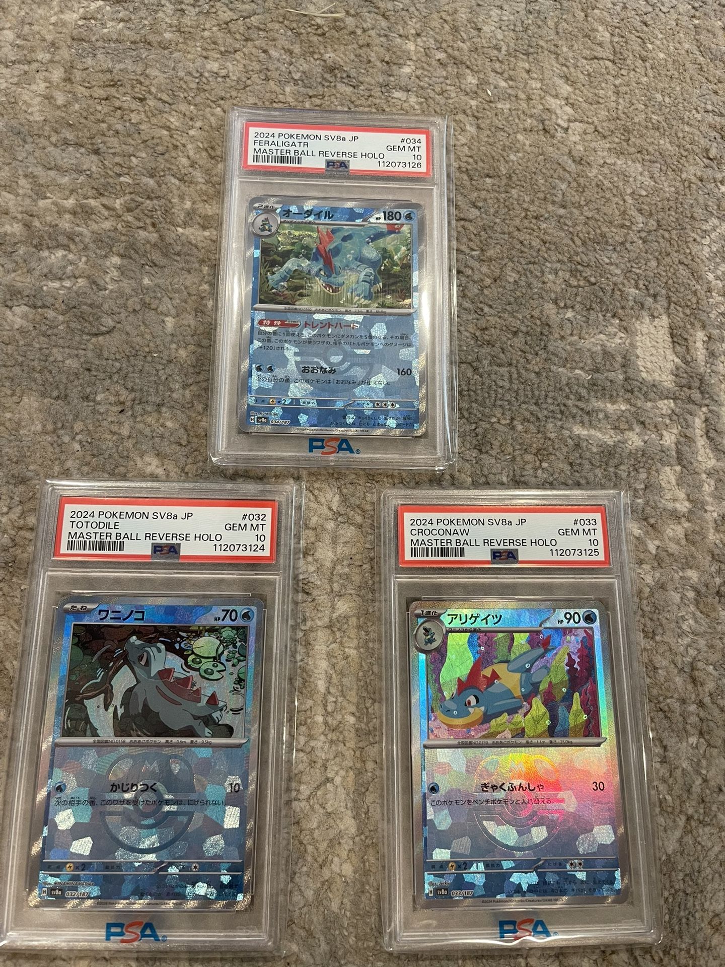 Japanese Terastal Festival Numerical PSA 10’s Totodile, Croconaw, And Feraligatr