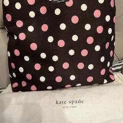 Kate Spade brown background polka dot fabric top handle handbag.