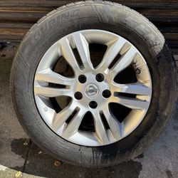 Nissan 15” Rim With Tire