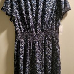 Women's Dark Blue Floral Print Puff Sleeved dress with a smocked elastic waistband and ruffled sleeves and hem Size plus size 0X