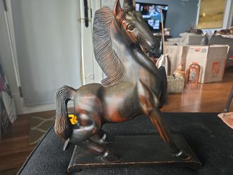 Carved dark wood horse figurine equestrian