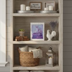 Charming Art Print Featuring A White Rabbit Atop Stacked Books