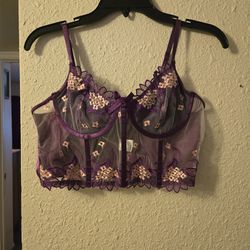 Purple lace bra with floral embroidery and bow detail. Size: L