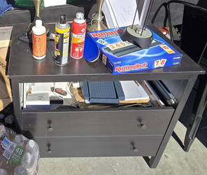 Dark two-drawer chest - visible wear