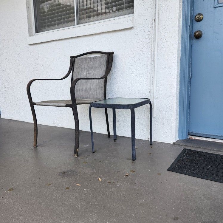 Cheap One person patio set you get a old porch chair and a drink table perfect for apartment or condo