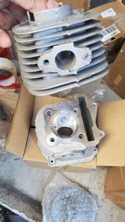 cylinder head assembly for a GY6 4-stroke engine, commonly found in 12 &KYrO
