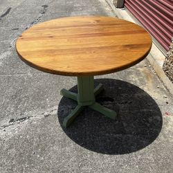 Vintage solid wood pedestal dining table.