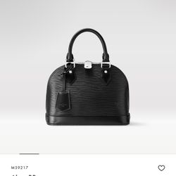 Black LV. Still has The Box and Bag 
