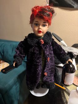 Collectible Doll with Red Hair and Coat