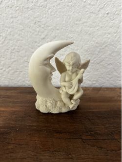 Moon and angel baby figure