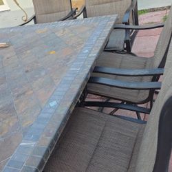 Outdoor patio furniture with umbrella and firepit