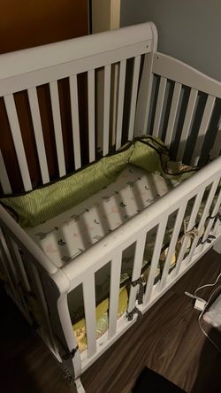 Wooden crib and Matress with protector.