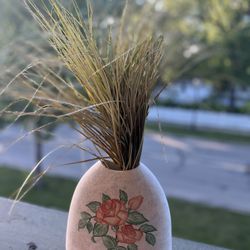 Vintage vase with fake grass