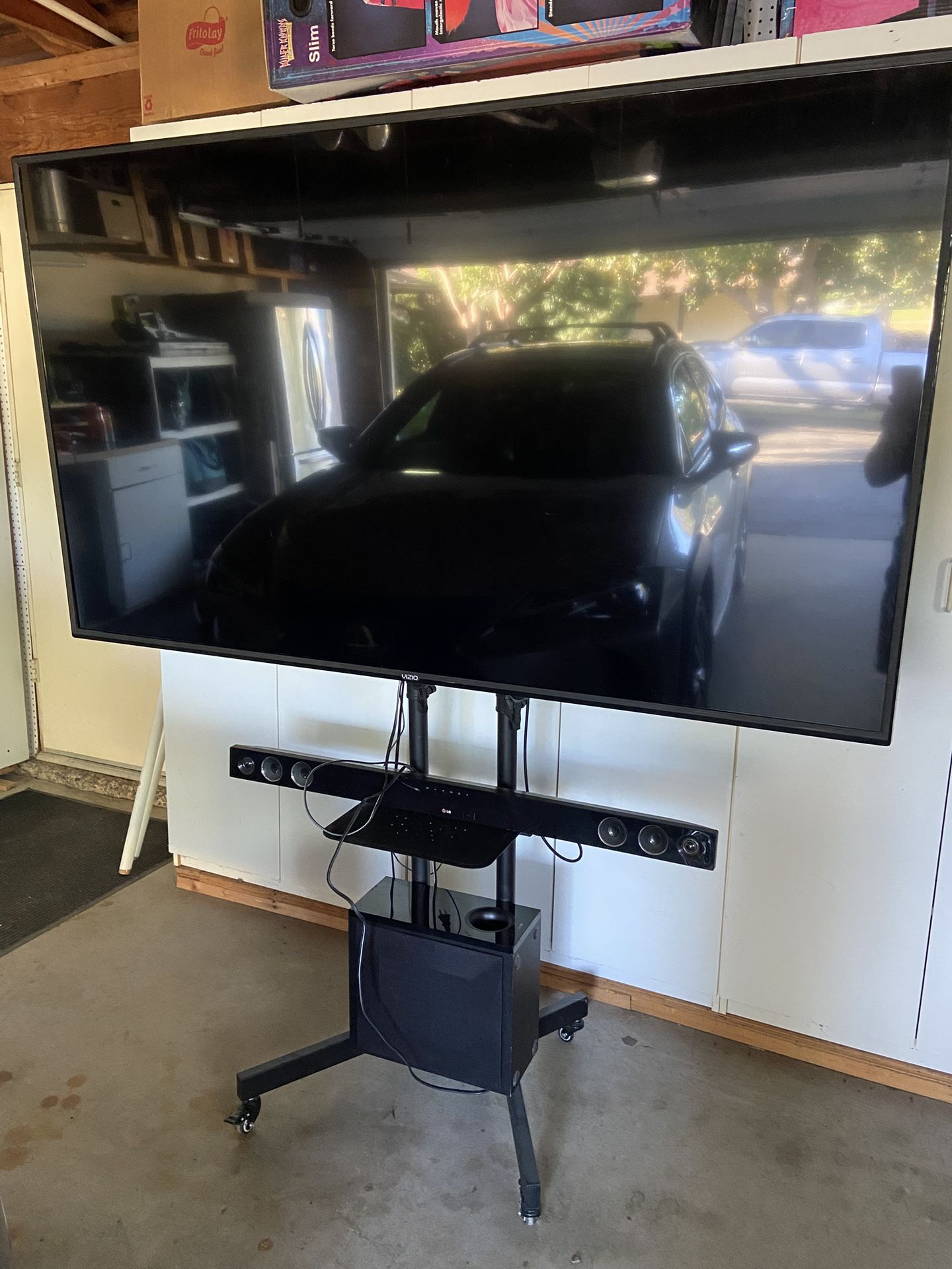 75 Inch Smart TV With Soundbar On Rolling Stand