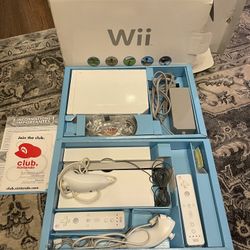Nintendo Wii With Two Controllers And Two Nunchucks  