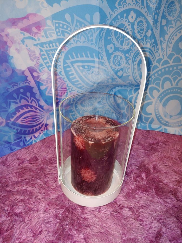Glass candle holder with candle