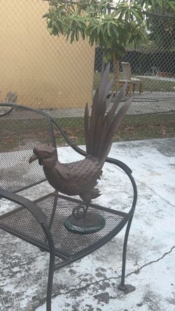 Mixed metal hand made land ornament.