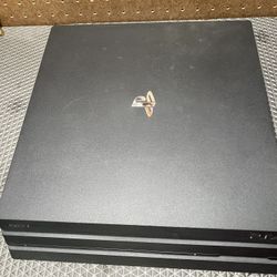Playstation 4 Pro W/ Two Controllers, And Charging Dock 