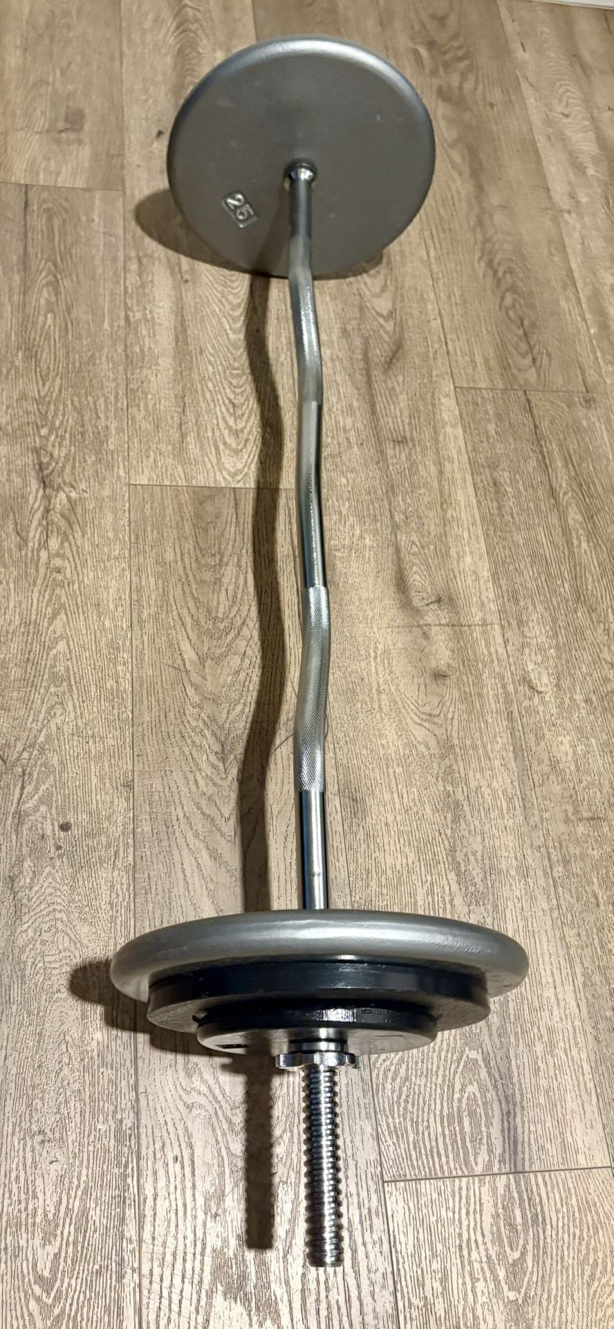 Curl Bar Standard With Pairs Of 25s 10s And 5 lbs Total: 94 lbs