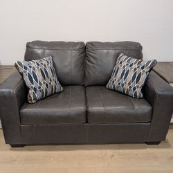 Ashley Furniture Leather Loveseat & Throw Pillows