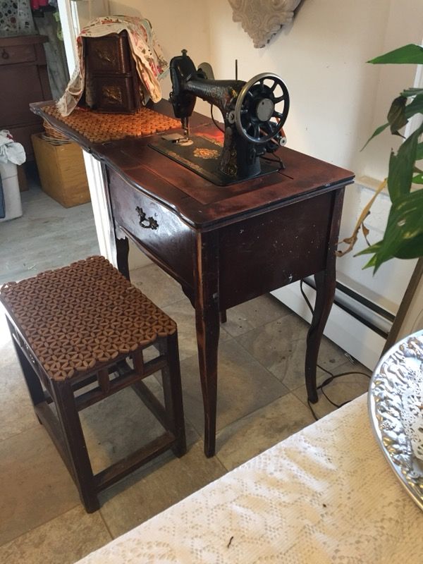 Stradivarius Cabinet and Operating Singer Sewing Machine.