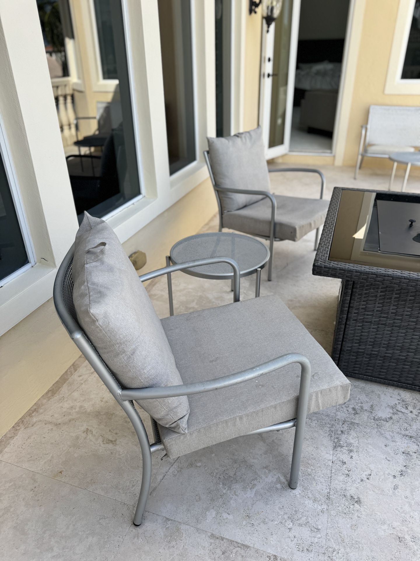 Two Large Metal Chairs With Table And Outdoor Cushions