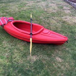 Kayak With Paddle And Lifevest 