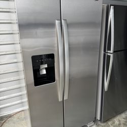 Whirlpool side-by-side stainless steel refrigerator (water and ice dispenser not working, selling as is). Dimensions: 68 7/8” height, 35 7/8” width, 3