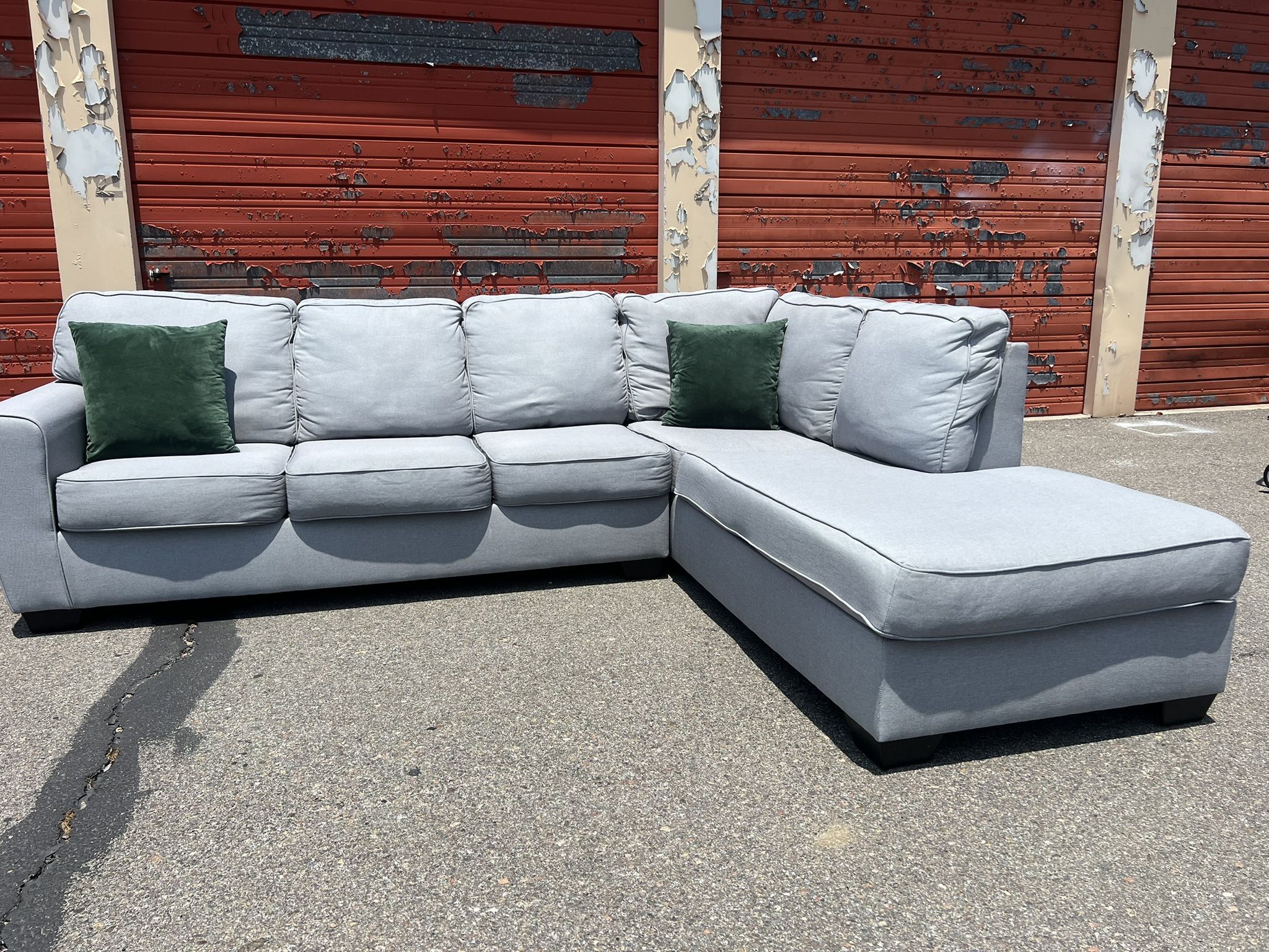 Ashley’s Gray Sectional Sofa Couch with right facing chaise