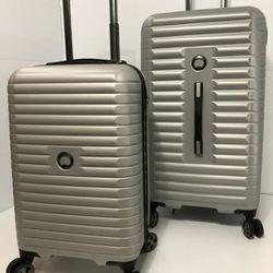 BRABRAND NEW DELSEY 2-PC HARDSIDE LUGGAGE SET WITH SPINNER WHEELS (CARRY-ON AND CHECKED LUGGAGE)