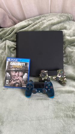 PlayStation 4 with 2 controllers and game