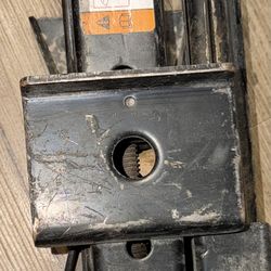 Used OEM (Original Equipment Manufacturer) scissor jack, specifically designed for several Ford Motor Company vehicles. The text and diagrams on its l