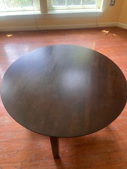 Round dark wood coffee table
