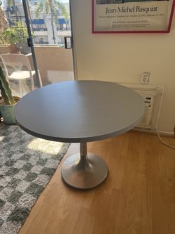 Round grey dining table