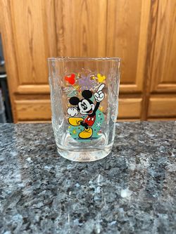 Walt Disney World 2000 Mcdonald's Commerative Glass Featuring Mickey Mouse.  Size approximately 4 1/2 inches tall.  Has been on display in a cabinet.