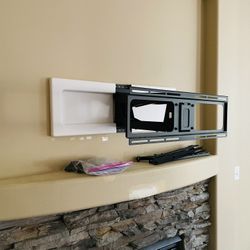 MantelMount: Height and Angle Adjustable TV mount over fireplace