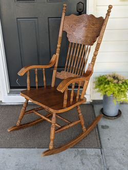Antique rocking chair with engraving design