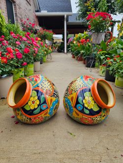 Orange RimTalavera Leaning Clay Pots (Planters) Plants. $55 cada una.