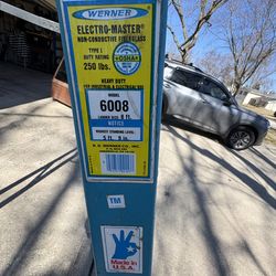 8’ fiberglass step ladder made by Werner 250 pound capacity