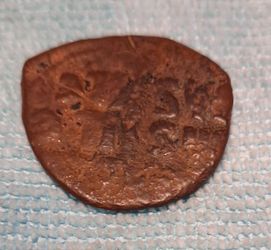 Ancient Copper Coin with Figure Design