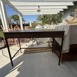 Wood look office desk with desktop power outlet