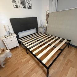 Black Metal bed frame with gray upholstered headboard - queen