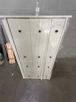 Tall White Wood Cabinet with Black Knobs