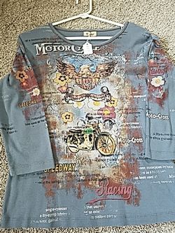 Motorcycle top for woman. Size medium. In new condition Eagle is in sequins.